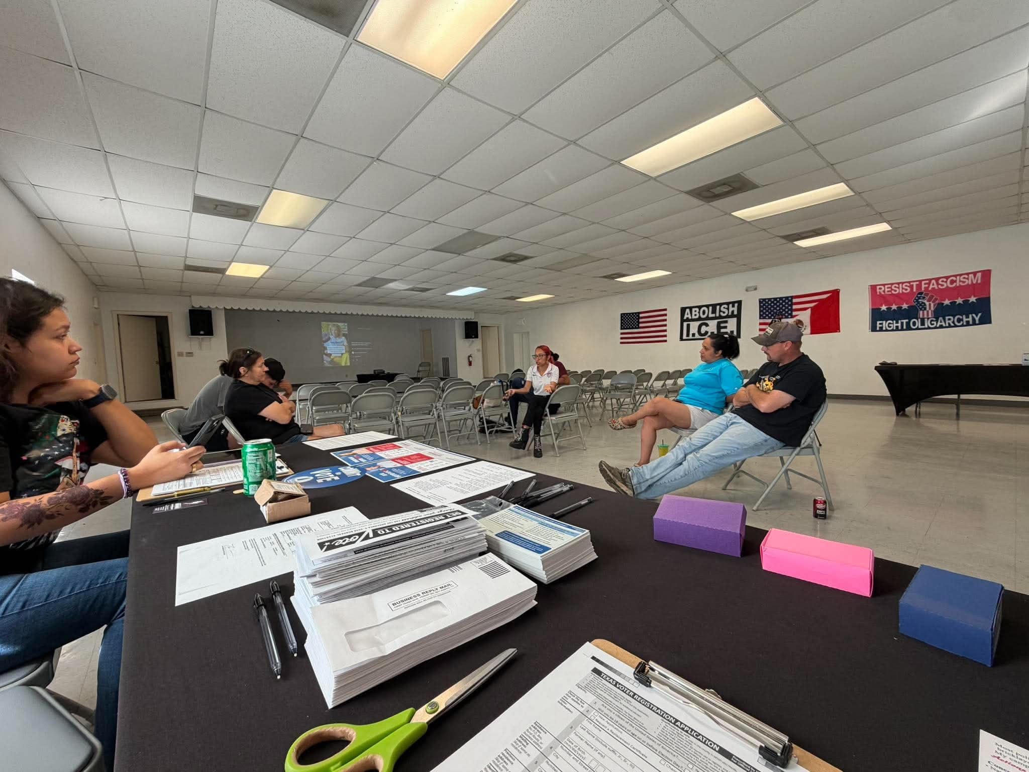 Attendees reviewing voter registration materials
