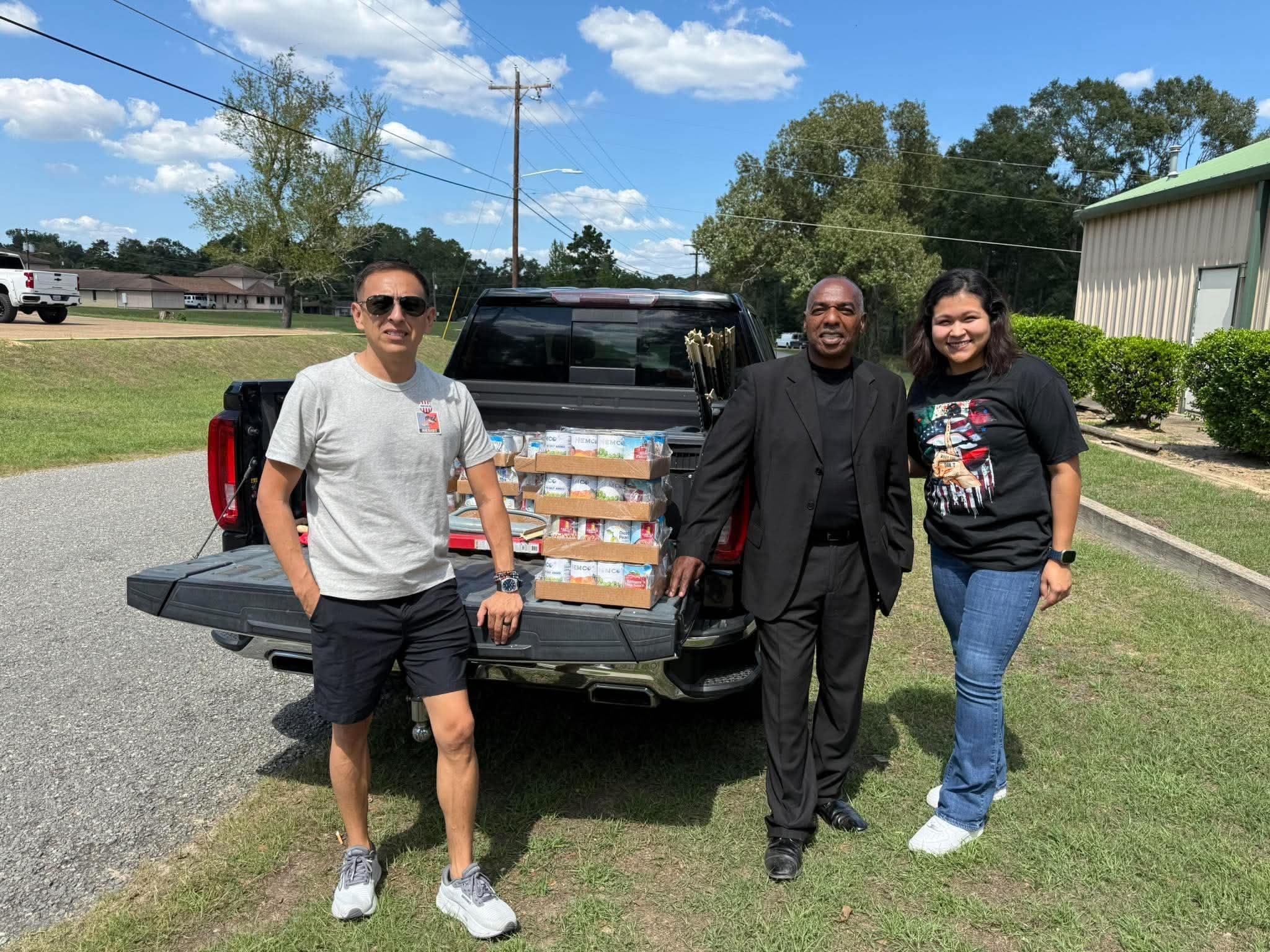 Volunteers with food drive donations