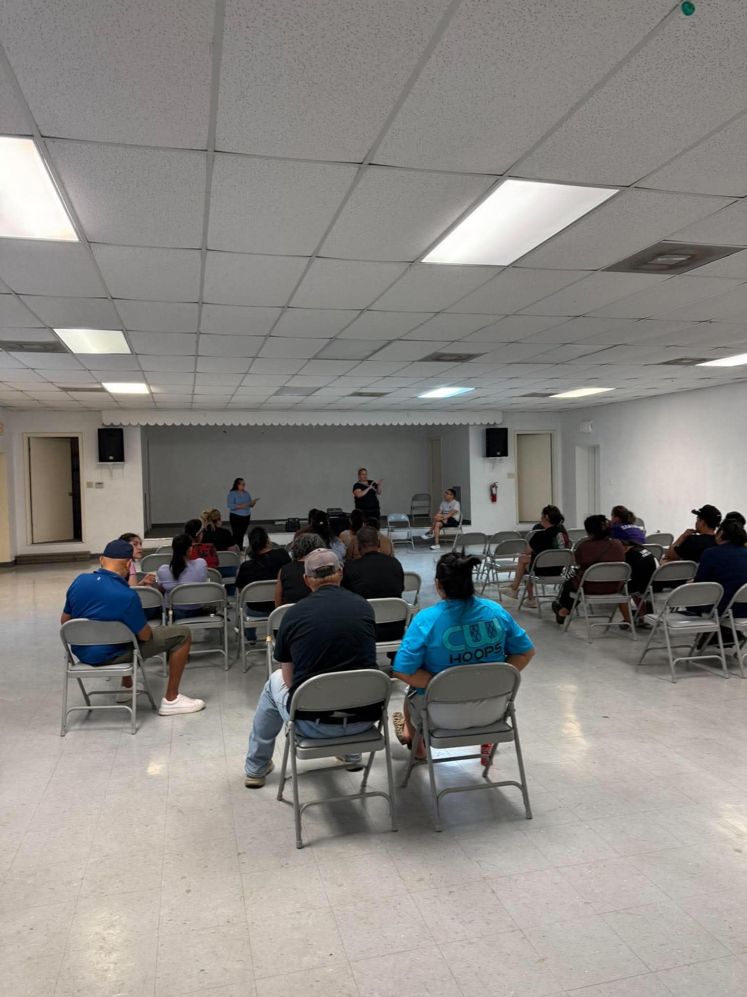 Presenters addressing the community gathering